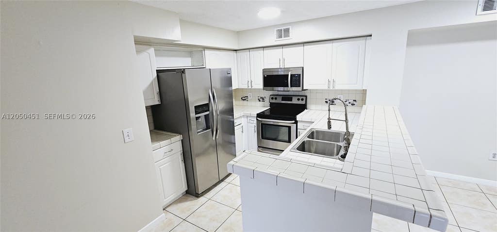 Photo of 1707 Village Blvd #208, West Palm Beach, FL 33409 (MLS # A12050451)