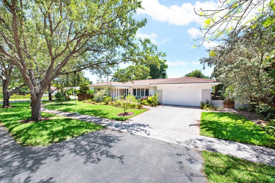 Elegance meets serenity in this luxurious 3BD/3.5BA pool home nestled in enchanting Miami Shores. Recently renovated, it boasts 2,788 sq.ft. of refined living space. Bathed in natural light, its solid oak floors and captivating Restoration Hardware lighting create an ambiance of timeless allure. Indulge in culinary delights with high-end appliances and a custom wet bar. The primary suite is a haven of tranquility, featuring a spa-like bathroom and ample closet space. Step outside to a covered patio, inviting pool, and an outdoor kitchen, perfect for creating cherished memories. With a gas tankless water heater, impact windows, and a 2-car garage, modern comforts are seamlessly woven throughout. Located just moments away from the Design District, MIA Airport, and pristine beaches.