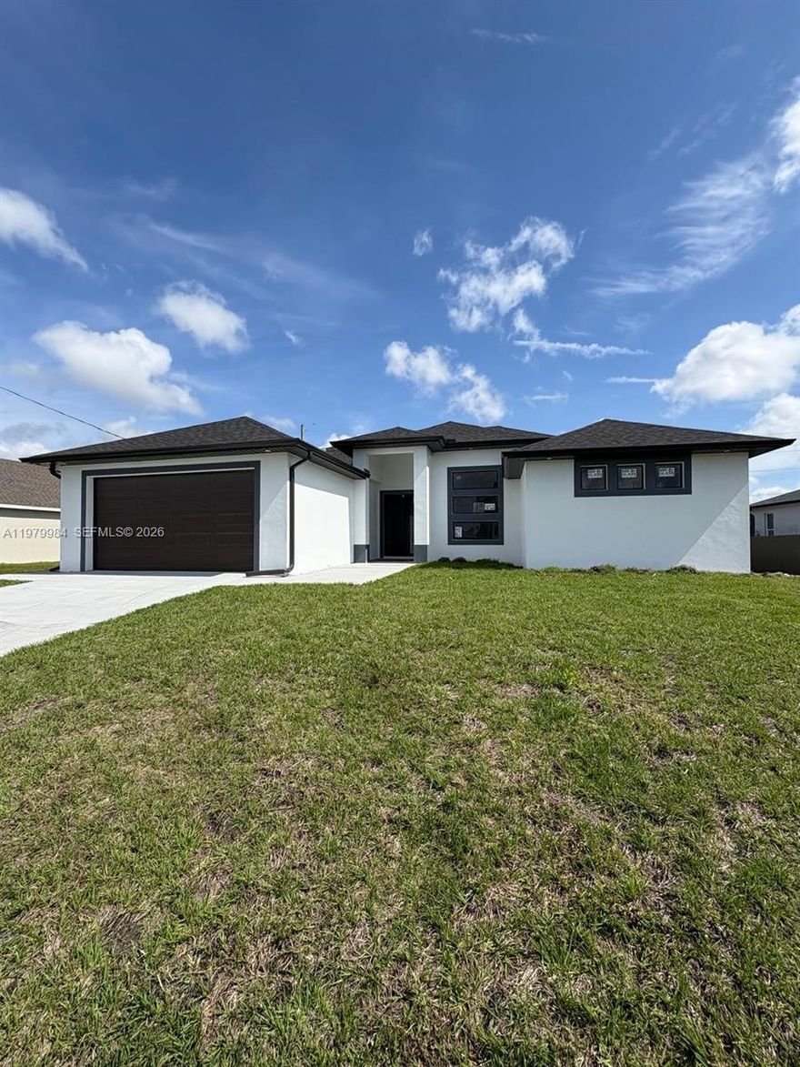 This stunning new construction features impact windows and doors, tile flooring throughout, and a beautifully designed kitchen with great cabinets and quartz countertops. Enjoy brand-new appliances, vaulted ceilings, and impeccable finishes that elevate the entire space. Perfectly situated in Cape Coral, it's just a short distance from Coral Oaks Golf Course. Don't miss the opportunity-come see it for yourself!