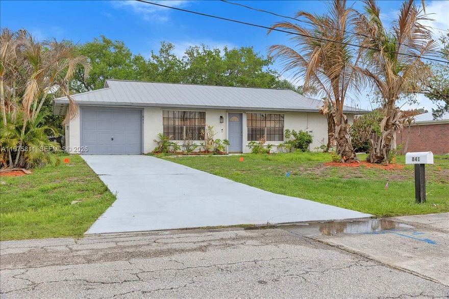 Welcome to this well-maintained 3-bedroom, 2-bathroom single-family home located at 841 NW Riverside Dr in beautiful Port Saint Lucie. This inviting residence offers a comfortable and functional layout, perfect for family to enjoy with a spacious backyard for relaxation or entertainment. The home offers a split floor plan with a private bathroom for the primary suite and one bathroom for the two bedrooms located across the living space. Conveniently located close to I-95 and the Florida Turnpike, this home offers easy commuting and quick access to shopping, dining, schools, parks, and everything Port Saint Lucie has to offer. Situated in a quiet residential neighborhood, it also provides the comfort of peaceful living with city conveniences nearby. Schedule your showing today.