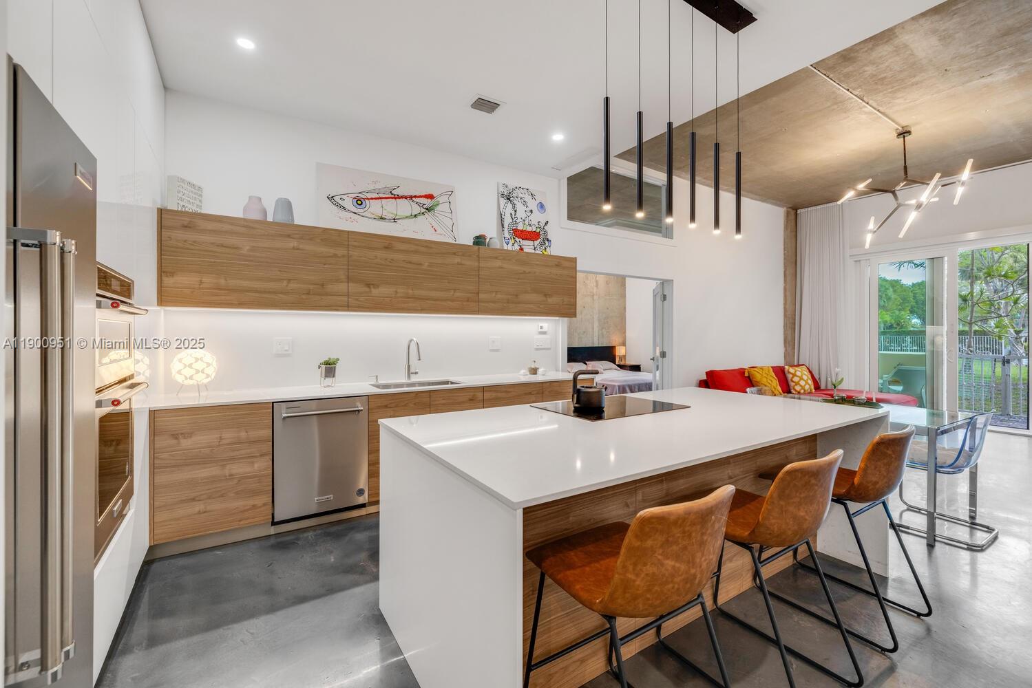 Exquisitely renovated by owner architect, this 2 bedroom, 2 bath stunning residence offers a sophisticated loft-style design with 11 ft ceilings and an open floor plan the seamlessly connects the kitchen, dining and living areas. High quality finishes and thoughtful details throughout the unit.
Enjoy the convenience of a garden entrance, creating a private oasis. Split floor plan, high impact windows, central AC, washer and dryer in unit and prime location at the Jockey Club. Pool and pool house amenities. Includes internet, cable and hot water. 1 parking spot and guest parking available.