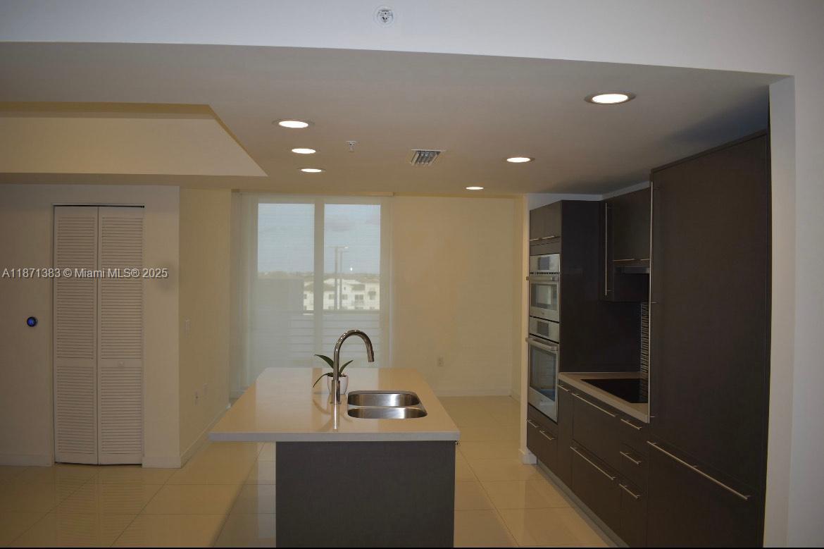 Welcome to this beautiful 1-bedroom, 1.5-bathroom condo at 7661 NW 107 Ave in Doral! Step into a bright open living space with modern finishes, a gourmet kitchen with stainless steel appliances, and plenty of storage. The spacious bedroom offers a walk-in closet and a beautiful en-suite bathroom, plus an additional guest half-bath for convenience. Relax on your private balcony or enjoy the community’s resort-style amenities, including a pool, gym, and sauna. Perfectly located near Downtown Doral, Dolphin Mall, CityPlace, top-rated schools, and easy access to major highways.