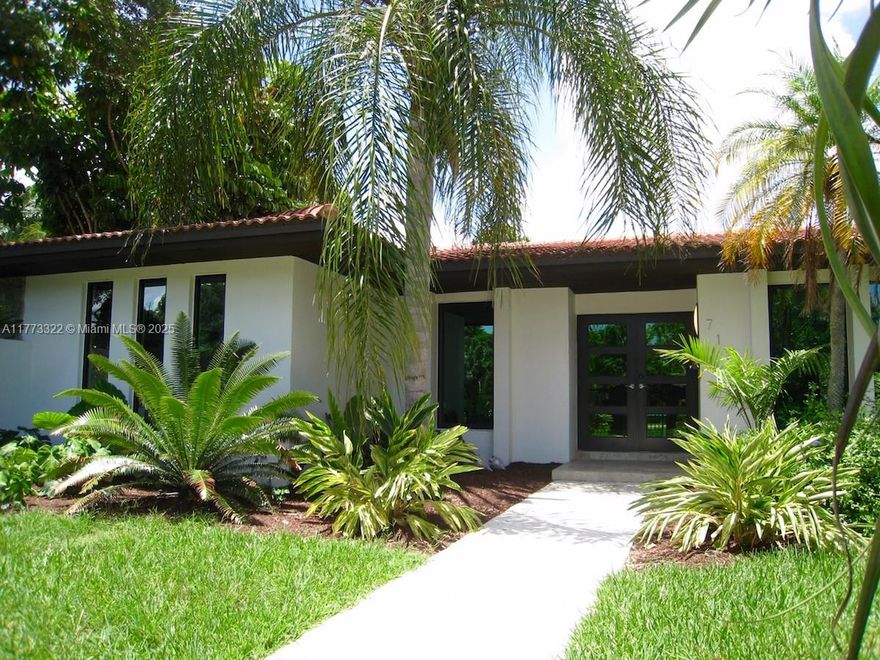 Beautifully remodeled with an open and modern flair featuring Subzero and Wolf appliances, Hansgrohe fixtures, PGT impact doors, Wolf induction cooktop, Italian interior doors and Italian white kitchen with quartz countertops and much more.  Gated and pavered driveway, beautifully landscaped with private and spacious backyard.  Indoor laundry and finished two car garage.