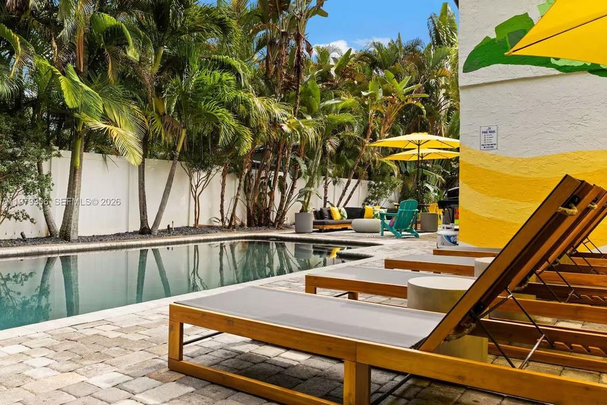 Resort-style pool home on an oversized 11,000+ sq ft corner lot in one of the hottest areas of Wilton Manors. Surrounded by lush landscaping and designed for privacy, this 4 bedroom, 3 bath residence features impact windows throughout, filling the open living spaces with natural light and tropical views. The updated kitchen and modern baths offer stylish comfort, while two ensuite bedrooms create ideal flexibility for guests, multigenerational living, or strong rental income potential. The expansive primary suite sits in its own private wing with a dedicated AC and opens directly to a patio and lagoon-style pool, creating the ultimate indoor-outdoor retreat. The backyard is built for entertaining with new turf and a mini golf area, delivering a true resort-style setting with minimal maintenance. Additional highlights include a 2 car garage, two separate driveways, new vinyl fencing, upgraded electrical and insulation, and a full house generator for peace of mind. Minutes from Wilton Drive, Las Olas, beaches, I-95, and Fort Lauderdale Airport, this property is ideal as a primary residence, vacation home, or high-demand Airbnb investment opportunity in one of South Florida’s most sought-after destinations.