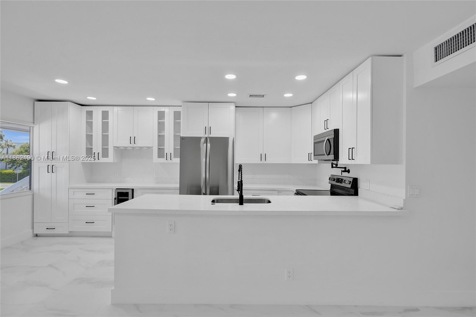 Step into this freshly renovated unit featuring impact windows and doors throughout.The open-concept kitchen is a chef’s dream with ample cabinet space, a pot filler for convenience, and a built-in wine cooler for wine enthusiasts. Enjoy porcelain tile flooring, modern zebra blinds, and beautifully upgraded bathrooms. The community offers courtesy buses to nearby shopping and beaches, plus an array of amenities including multiple pools, theater, exercise room, pickleball courts, and more.
This stunning unit truly has it all, don’t miss the chance to make it yours!