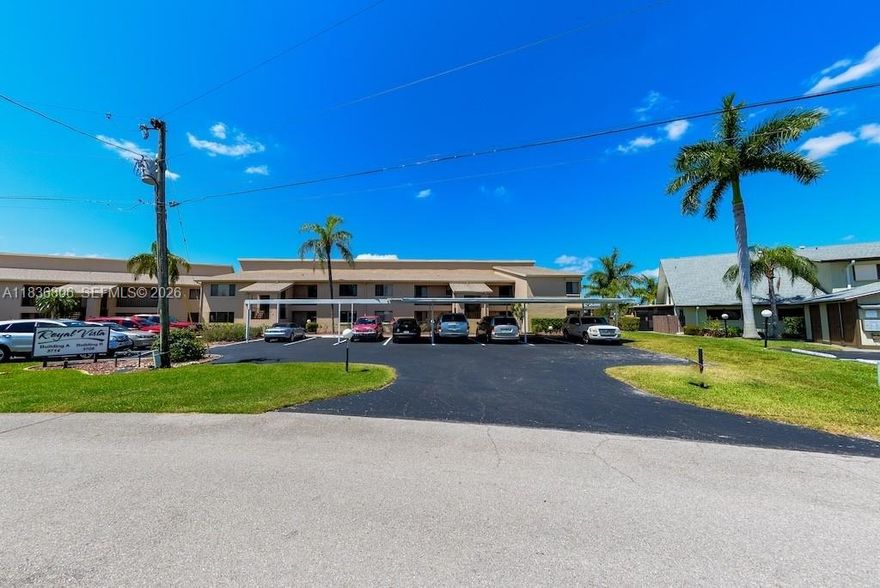 Welcome to this well maintained 3-bedroom, 2-bath corner unit in the sought-after Royal Vistas 55+ community. Stunning water views, incredible convenience, & the relaxing Florida lifestyle you’ve been dreaming of. Enjoy the community heated pool, or take just a few steps to the first-come, first-serve community dock with Gulf access—only minutes to open water. Inside, you’ll love the sliders from the owner’s suite to the screened lanai, & peaceful water views. The lanai includes a washer & dryer along with extra storage. Updates include A/C in 2021, new water heater, electric storm shutters-lanai, roll-down shutters on windows, & plantation shutters. Enjoy the built-in central radio system, allowing music to be played in every bedroom. HOA dues have DECREASED over $400 a quarter! Saving you money and making the property more affordable!!