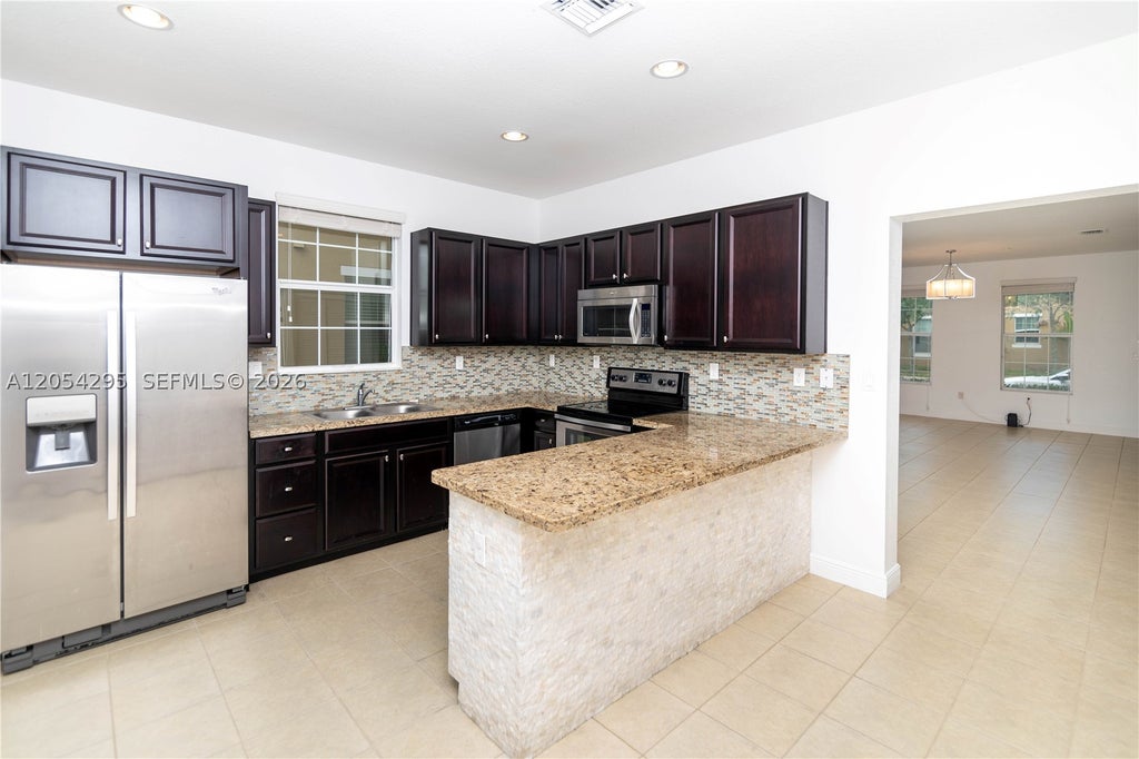 Photo of 1510 SW 147th Ter, Pembroke Pines, FL 33027 (MLS # A12054295)