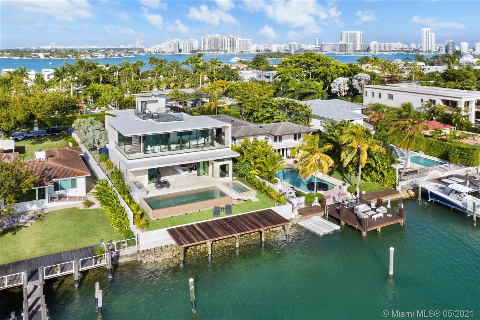 NEW LUXURY WATERFRONT VILLA on one of Miami Beach’s most coveted addresses - HIBISCUS ISLAND. Designed by architect Borges Architecture & Design, this modern masterpiece is the perfect home for anyone looking to enjoy the best Miami has to offer. This beautiful 5 Bedroom, 5.5 Bathroom home features: rooftop deck with 360 degree views of the Miami skyline, infinity edged pool with sunset vistas of Biscayne Bay and outdoor bbq, Ornare custom kitchen, bar, full-length wine cellar, floating staircase, spacious master bed with marble bath, Mia Cucina his/her, floor-to-ceiling sliding doors, 2-car garage, elevator & more. Move-in ready with full furniture package.