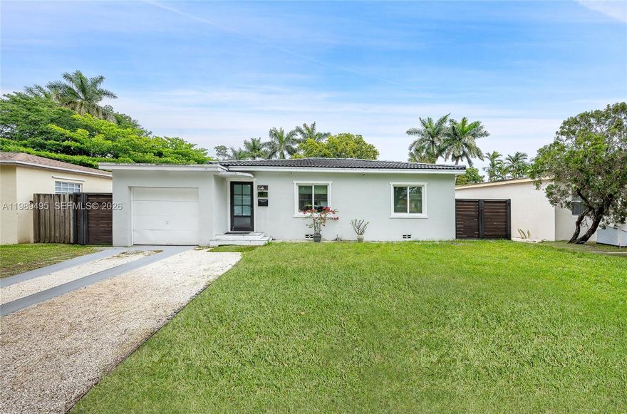 Welcome home to this charming 3/2 in Miami Springs! The home features spacious open-concept layout, a bright living area and natural light throughout.  Impact windows and doors, wood cabinetry, marble countertops. Updated bathrooms and kitchen. The garage was converted providing an additional bedroom. Enjoy a large backyard, perfect for entertaining, room for pool or expansion. Mango tree, shed.  Minutes away from the airport, shops and major highways.