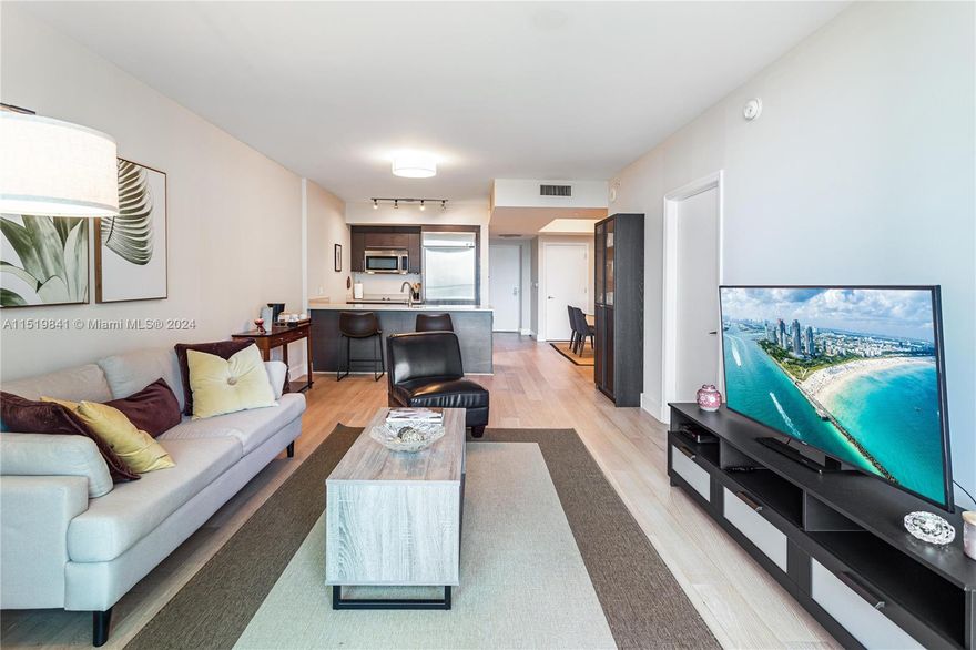 Bring only your suitcase! Beautifully furnished 1 bedroom 1 bath + Den/Office with water views in the heart of the Financial District, one block from Brickell City Center! This light and bright apartment features ample master bedroom with spacious walk-in closets, floor to ceiling windows, gorgeous wood floors throughout and an oversized balcony. European kitchen with stainless steel appliances, granite countertops. Bathroom features a separate tub and glass shower.  A Full-Service Building with Unmatched 5 Star Resort Style Amenities - 2 swimming pools, gym, Spa, Jacuzzi tub, theater room, 1 parking space, valet, security, footsteps from the best in Brickell. A must-see property! Unit is available to 6-12 month rental furnished or unfurnished.