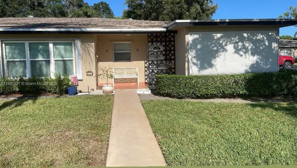 Photo of 1022 Circle Dr #D, Delray Beach, FL 33445 (MLS # A11801227)