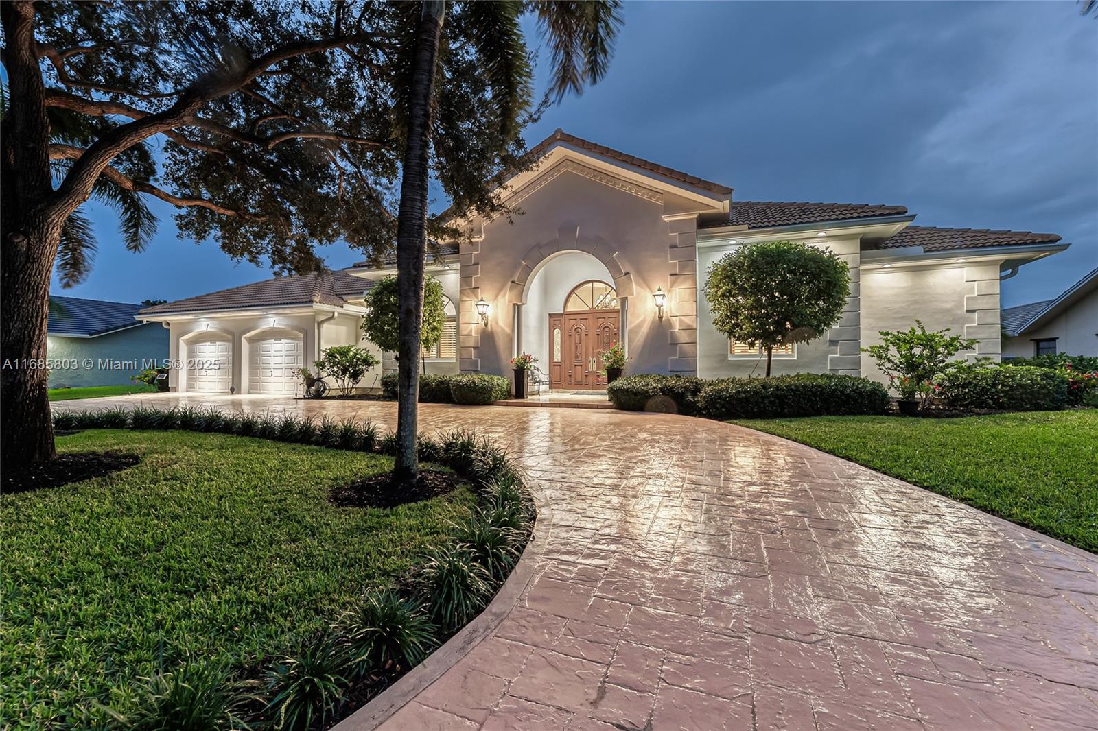Nestled within the prestigious Lago Mar Colony, this exquisite 4-bedroom, 4.5-bath home boasts over 5,000 sqft with stunning golf and water views. This custom-built home features soaring high ceilings, elegant wood-built ins, and custom doors that exude a warm decor. Be captivated by the gourmet kitchen, tailored for the casual chef and the culinary enthusiast. It's a perfect setting for entertaining family and friends, with high-end appliances, ample counter space, and custom cabinetry. The thoughtfully designed layout includes spacious bedrooms with en-suite bathrooms for ultimate privacy. Additional highlights include complete impact protection, a new heated pool, and a sundeck. Centrally located and close to all major highways, FLL airport, beaches, and American Heritage HS.