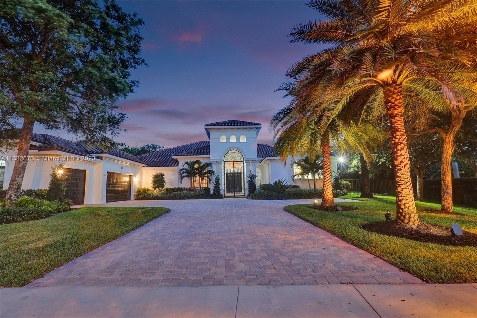 Presenting this magnificent estate on its own builder’s acre to make for a tropical paradise with detail at every corner. Elegantly designed by renowned AD Architecture. Upon entering, you are captivated with the voluminous ceilings of the immense foyer and a harmonious floor plan with endless entertainment. Featuring a smart home sound & security system, Viking kitchen appliances, wet bar, executive’s luxury office, hurricane impact windows, Italian closetry, motorized blinds & Italian drapery, home theater, water softener & osmosis filtration, summer kitchen with Twin Eagles beer tap systems, large built in grill & burner, vanishing heated & saltwater pool with Sun TV & outdoor sound systems, custom designed basketball court, richly hedged clusia yard, and many more upgrades to love!