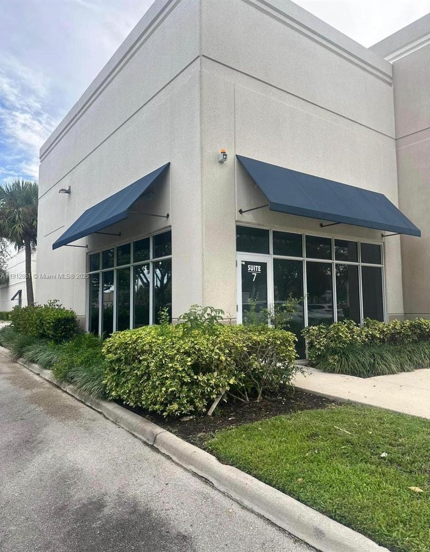 Exceptional corner  retail unit located at 2400 W Sample Rd Unit C7 in Pompano Beach, featuring approximately 1,143 sq ft of prime showroom or office space with high ceilings, impact windows, travertine marble flooring, five private offices, a kitchenette, restroom, rear exit, and four assigned parking spaces. Built in 2006 with solid concrete construction, this bright and modern unit offers excellent exposure on Sample Road—just minutes from the Turnpike, I-95, and Festival Marketplace. With a low monthly CAM of about $437, covering water, sewer, trash, and exterior maintenance, it’s ideal for owner-users or investors seeking a turnkey property in a thriving commercial corridor with strong rental demand and great visibility.