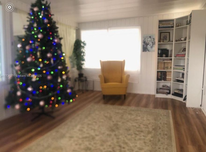 Come and see this affordable manufactured home at Palm Lake Estates 55+ gated community featuring split 2/2 floor plan with enclosed lanai, large driveway with carport and nice family area. Home is located in a nice gated community with three club houses, two hot tubs and three pools. Palm Lake Estates is an age-qualified community where at least one person has to be 55+ and the other can be 40 years or older. This is land lease, so there is a monthly rent that is is approx. around $967 per month. The fee consists of $782 base rent which includes basic cable, lawn mowing,  plus additional $185 for garbage, sewer and the pass thru property tax. Association approval is required.