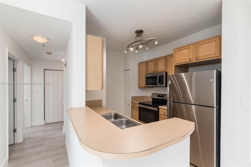 Bright and airy top-floor 2-bedroom, 1-bath unit with east-facing views and luxury laminate flooring throughout. Features include stainless steel kitchen appliances, in-unit washer/dryer and one assigned garage parking space. Freshly painted. Centrally located near UM, Larkin Hospital, Coral Gables, Coconut Grove, and Downtown South Miami, with easy access to Metrorail, bus lines, and major highways. Enjoy building amenities like a pool, fitness center, and 24-hour security.