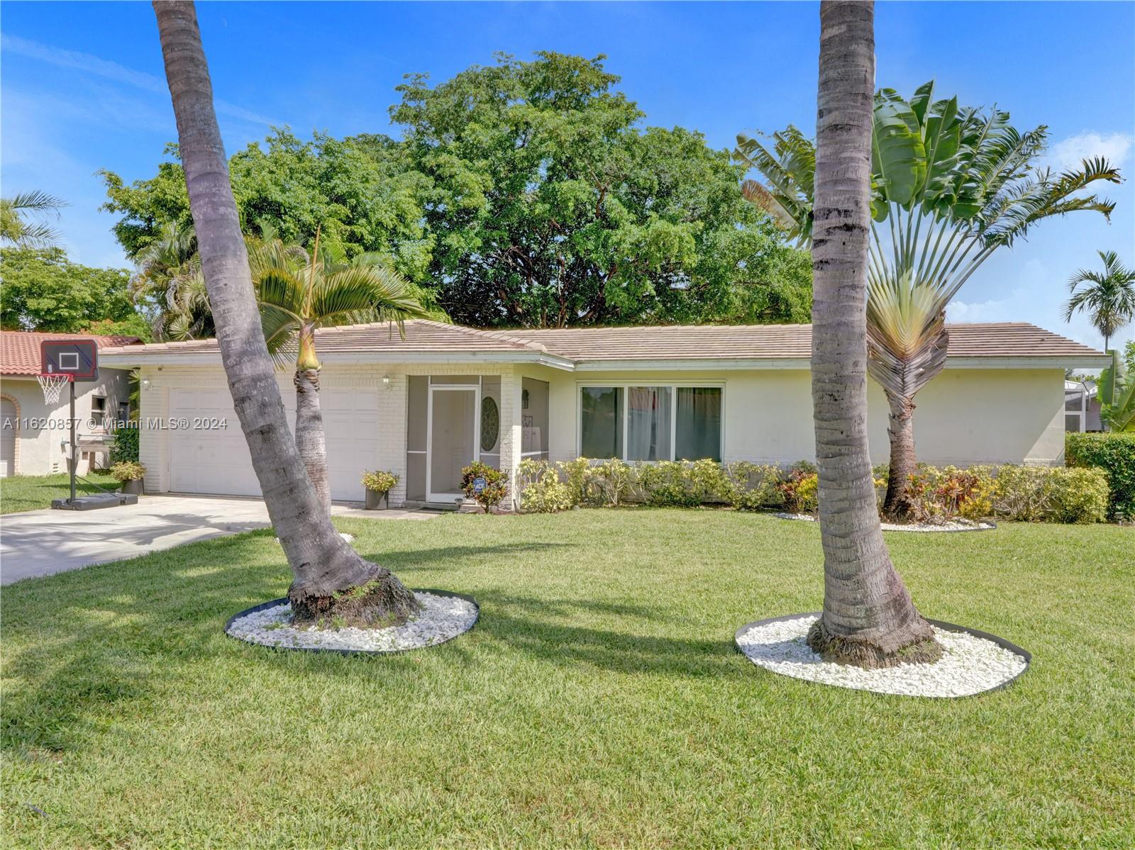 Beautiful ranch style 3 bed/2 bath home nestled in the sought-after Glennwood community of Coral Springs. This charming residence boasts impact windows and doors, stainless steel appliances, and an inviting open split floor plan that includes both living and family rooms. Outside, enjoy a backyard oasis complete with a pool, covered patio and beautifully fenced garden. Two car garage. No HOA. Ideally located within walking distance of Coral Springs Elementary School, this home is a must-see!"