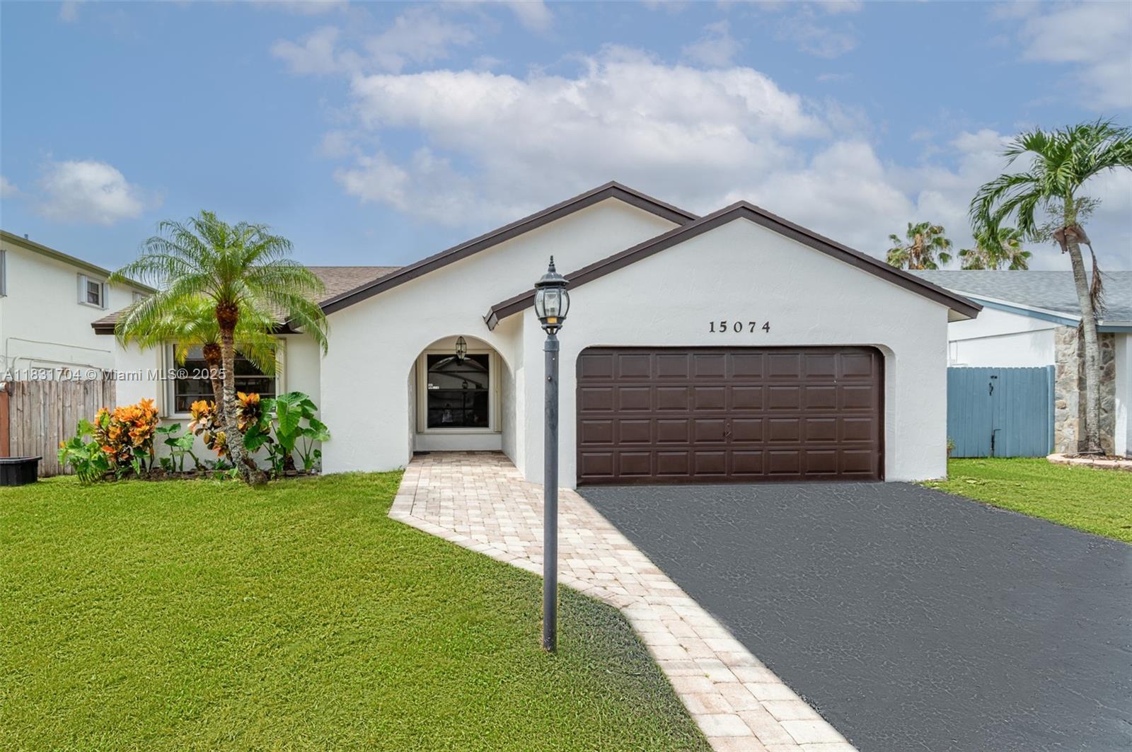 Discover this stunning 3 bed/2 bath home in the highly desirable New River Estates, known for its top-rated schools. Enjoy this 9,372sf waterfront lot with oversized pool and plenty of room for the kids to play. This property features an open floor plan with tile flooring throughout. Modern kitchen with stainless steel appliances. Freshly painted inside and out. NEW A/C. 2-car garage. Accordian shutter throughout. Located next to Weston, renowned for its multimillion-dollar homes and amenities, you'll have easy access to 595, shops, restaurants, and more!
