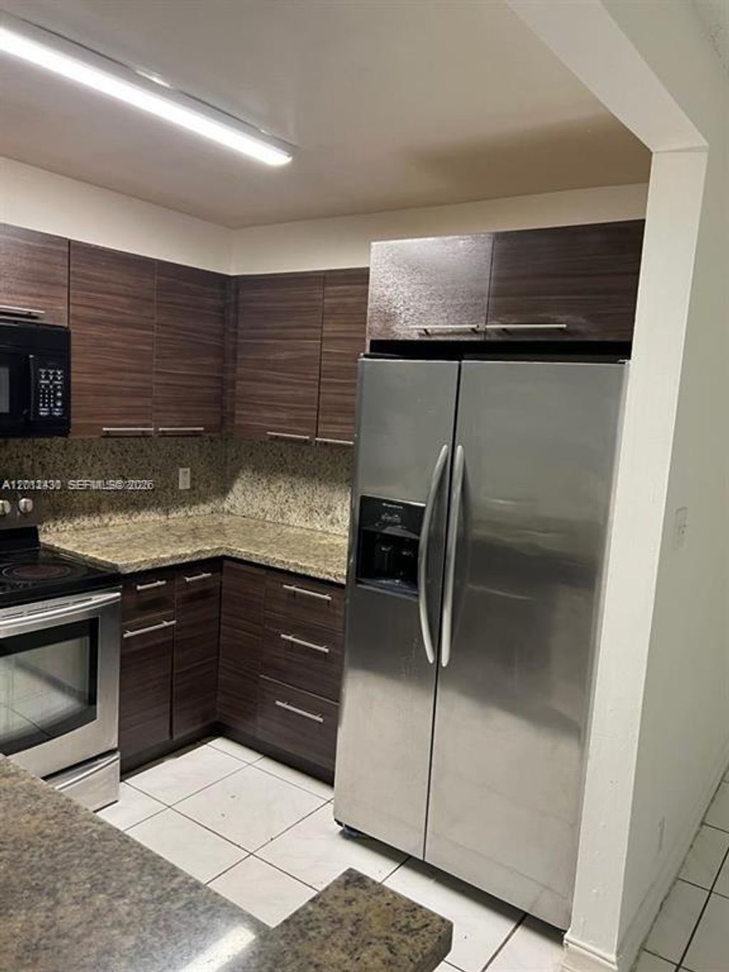 Photo of 5955 NW 25th Ct #208, Sunrise, FL 33313 (MLS # A12012430)