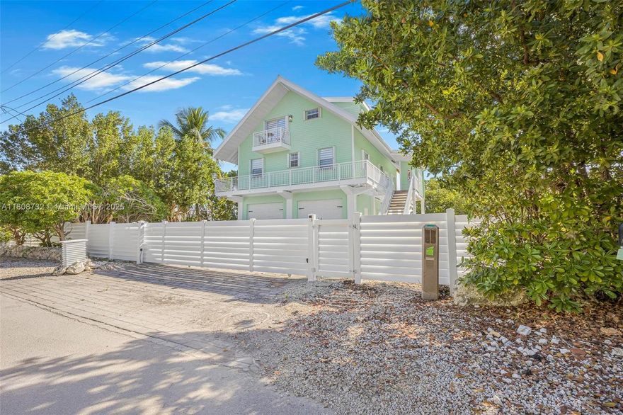 Stunning bayfront living in Key Largo’s sought-after Buccaneer Point! This 3BD/2.5BA home boasts breathtaking open water views with direct ocean access via the bay—perfect for boaters. The main living area is on the 2nd floor, featuring soaring wood-beamed ceilings, a modern kitchen with quartz countertops, and light-filled spaces with panoramic water views. The large primary suite on the 3rd level includes a spa-like bath and a private balcony. The roof is less than one year old.Downstairs, enjoy a spacious garage and an impressive bar/lounge area ideal for entertaining. Enjoy outdoor living with parking for multiple vehicles, RVs, or trailers, space for a pool, and a wood dock with a boat slip offering direct bay access. No HOA! Don’t miss this opportunity—check it out now.