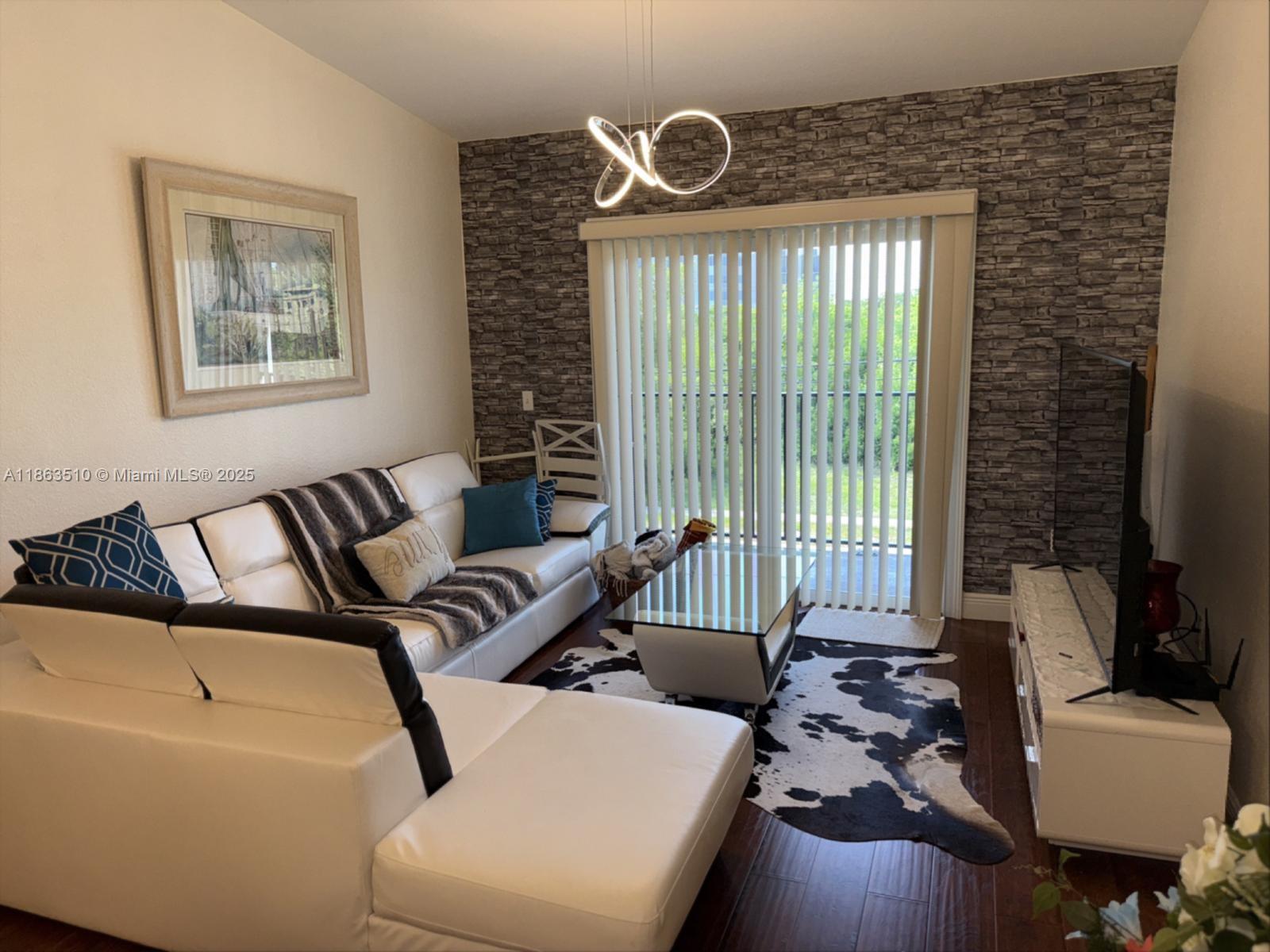 MOTIVATED SELLER!! Bring your best offer. Beautifully renovated condominium corner unit in a very private and well-maintained location. This unit features vaulted ceilings, an updated kitchen with appliances in excellent condition, and offers a great opportunity for both investors and families. The community boasts fantastic amenities, including a clubhouse, pool, and gated entry. Conveniently located near shopping centers and just a short drive from the Florida Keys.