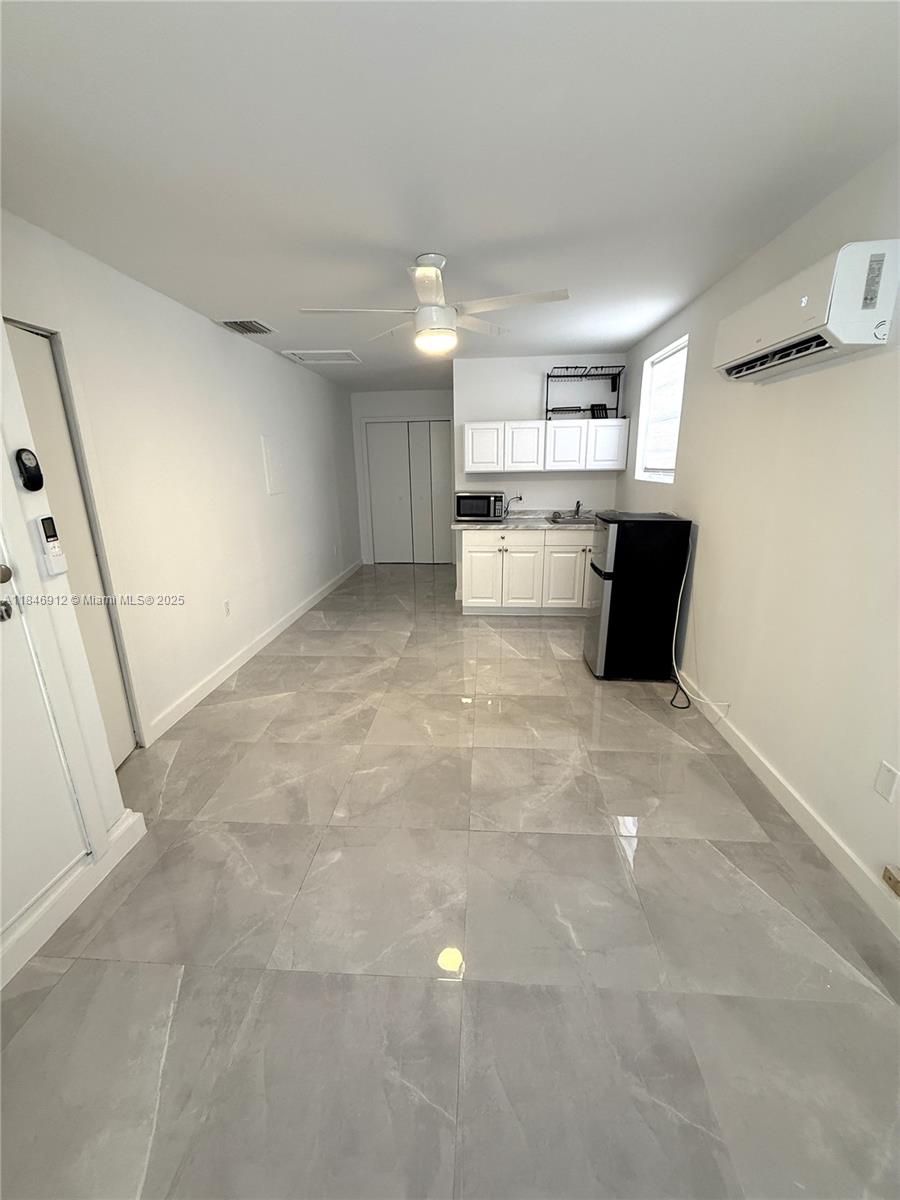Smart living starts here! Discover this freshly painted efficiency in desirable Miami Springs. Enjoy your partial private patio and the ultimate ease of all utilities included – water, electricity, and internet! Designed for one occupant, this unit offers convenience without compromise. Includes 2 parking spots. No washer/dryer.