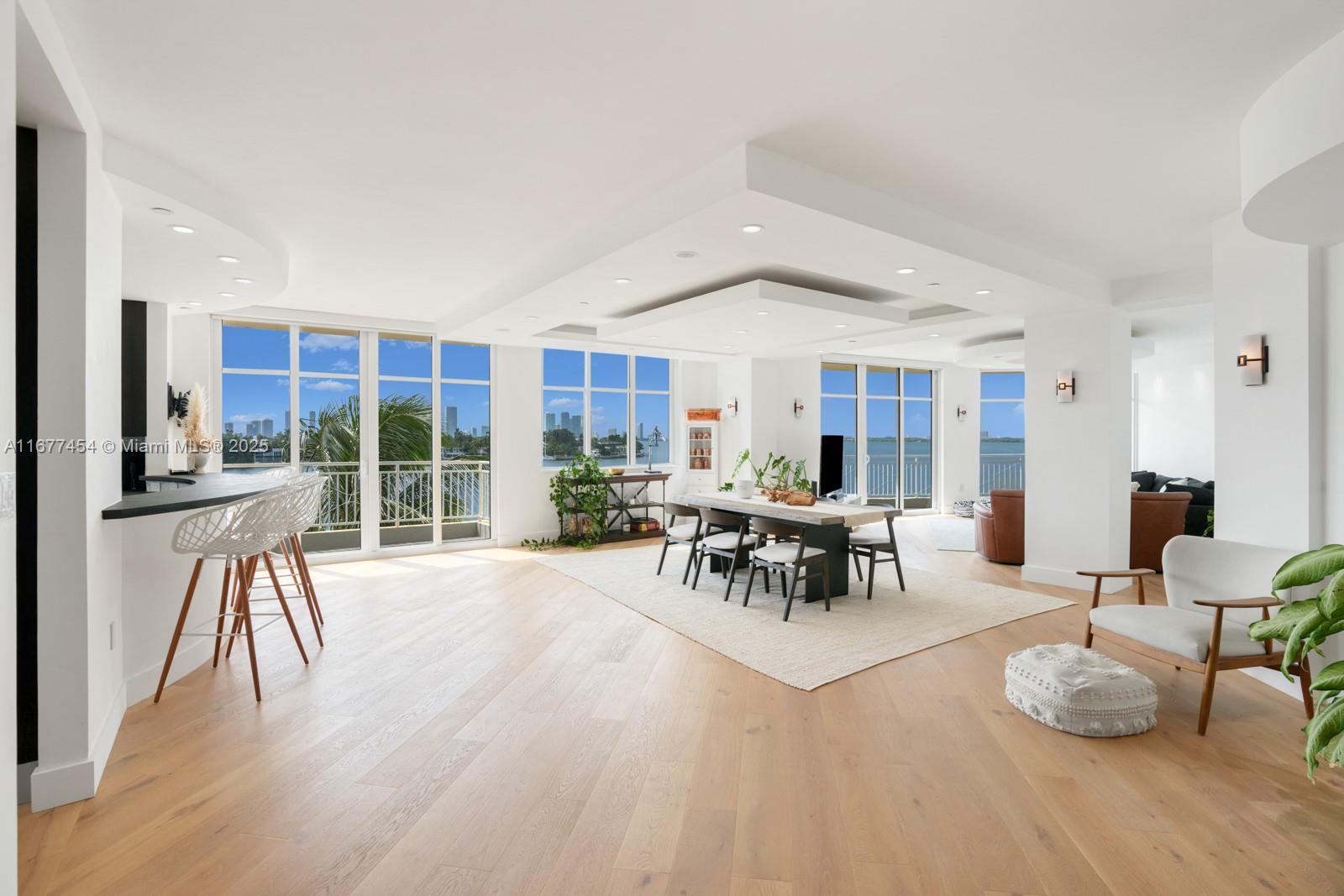 A one-of-a-kind, 3,400+ square foot residence with sweeping water views of the Miami skyline, with expansive aqua vistas encompassing the prestigious Venetian Islands and Downtown. Nestled in a boutique building, the grand entry welcomes you with suspended ceiling features and striking architectural details, blending classic and contemporary styles. Imported Italian finishes and white oak floors throughout. Snaidero Signature Kitchen is outfitted with top-of-the-line appliances, a Calcutta Gold stone island, and lava stone countertops. Floor-to-ceiling glass doors invite fresh aquatic breezes, while 507 and 508 have been combined, offering three garage spaces for your convenience.