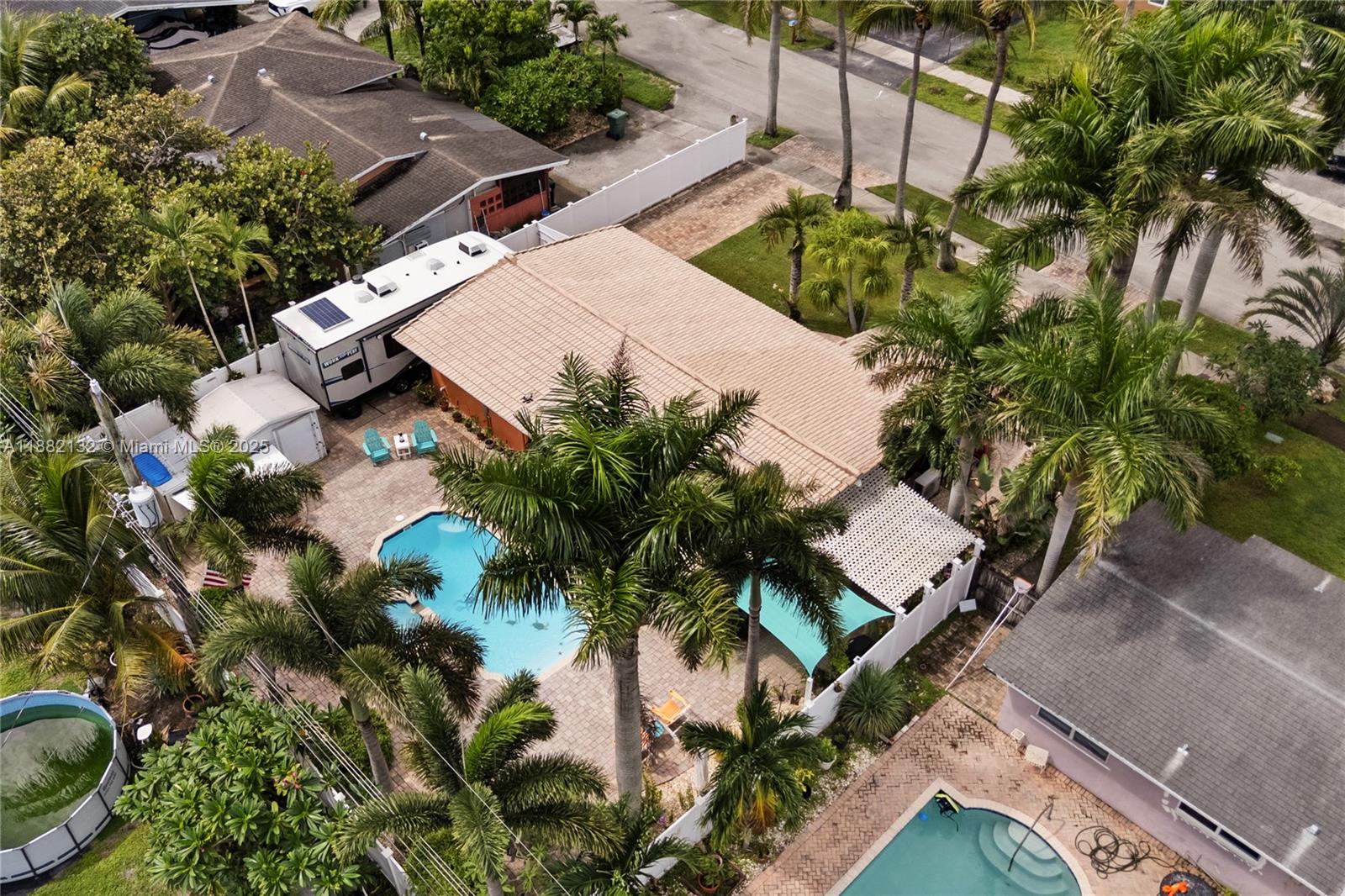 Ft Lauderdale ~Riverland~**~No HOA~**Immaculate 2 Bedroom/1 Bath~SF-Home w/private Saltwater Pool + Spa!~Dade Pine open beam tongue & groove vaulted ceilings, fresh coat sealed & waxed terrazzo floors, impact windows, fresh paint in/out & well-maintained 15-yr roof w/30-yr lifespan.~*Carport w/extra electric for easy future bed/bath addition.~*Close to schools, highways & minutes to the beach.~*PVC piping, newer electric, paver drive, & All around!~*40 X 12 RV/boat parking~Can fit 33' RV,~lush landscaping, sprinkler system + lighting, fenced yard oasis & so much more—**This one is a must see!
