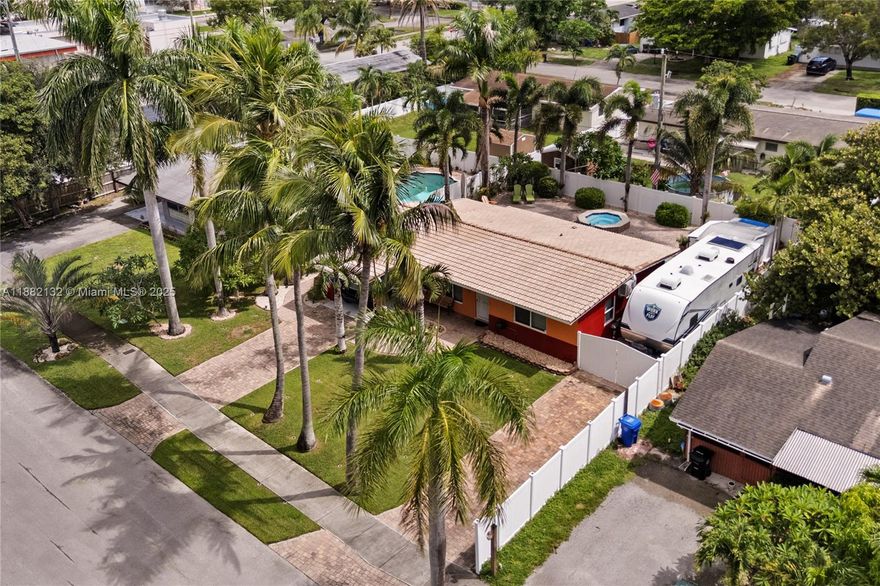Ft Lauderdale ~Riverland~*~No HOA~*Immaculate 2 Bedroom/1 Bath~SF-Home w/private Saltwater Pool + Spa!~Dade Pine open beam tongue & groove vaulted ceilings, fresh coat sealed & waxed terrazzo floors, Impact Windows, Fresh paint In/Out~ Well-maintained 15-yr roof w/30-yr lifespan~*Carport w/extra electric for easy future Bed/Bath addition~*Close to schools, highways & minutes to the beach~*PVC piping, Newer electric,Expansive paver driveway and fully hardscaped exterior w/custom paver accents~*40 X 12 RV/boat parking~Can fit 33' RV,~lush landscaping, sprinkler system + lighting, fenced yard oasis & so much more—*This one is a must see!*Convenient to all major travel arteries in Ft Lauderdale~Room to Grow in this spectacular property~Close by 12/31/25 and declare Homestead savings for 2026!