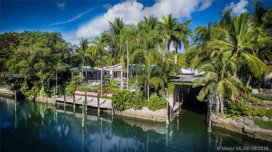 Exceptional Coral Gables waterfront home is a Boater's Dream defined by architectural integrity, quality finishes and expansive indoor/outdoor spaces for relaxed living & gracious entertaining. Exquisite main rooms - living, dining, eat-in gourmet kitchen, media room, playroom, grand master suite & private in-law quarters. Beautiful grounds include covered patios, mosaic tile pool & spa, summer kitchen, cabana bath, custom artisan fences, aquarium, rare 1,250sf coral-stone boathouse and large boat dock.