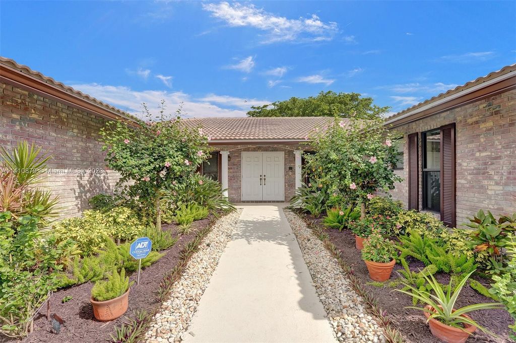 Photo of 1342 NW 100th Dr, Coral Springs, FL 33071 (MLS # A11410879)