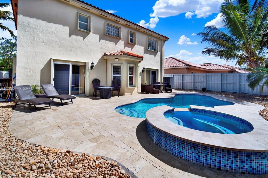 $5,000 Seller Credit towards rate buydown/closing costs. Welcome to a home that seamlessly blends lifestyle, comfort, and true pride of ownership. Located in a secure, well-established community, this beautifully upgraded residence offers a rare opportunity to step into a move-in-ready home with quality improvements already completed. Inside, you’re welcomed by an open-concept layout that creates a natural flow between the living, dining, and family areas—ideal for both entertaining and everyday living. The home has been updated with upgraded flooring, creating a clean, contemporary feel throughout. The kitchen is equipped with updated appliances, offering both functionality and style. Step outside and discover what truly sets this property apart—a private, resort-style backyard retreat. With approximately $70,000 invested into the pool, along with additional landscaping and outdoor enhancements, this space is designed for year-round enjoyment, whether you're hosting or simply unwinding in your own oasis. Beyond aesthetics, this home reflects consistent care throughout, including hurricane protection and well-maintained systems that provide added peace of mind. The community itself enhances the overall lifestyle, offering 24-hour security, police patrol, and resort-style amenities including a clubhouse and fitness center—all within a safe, walkable, and well-maintained environment.