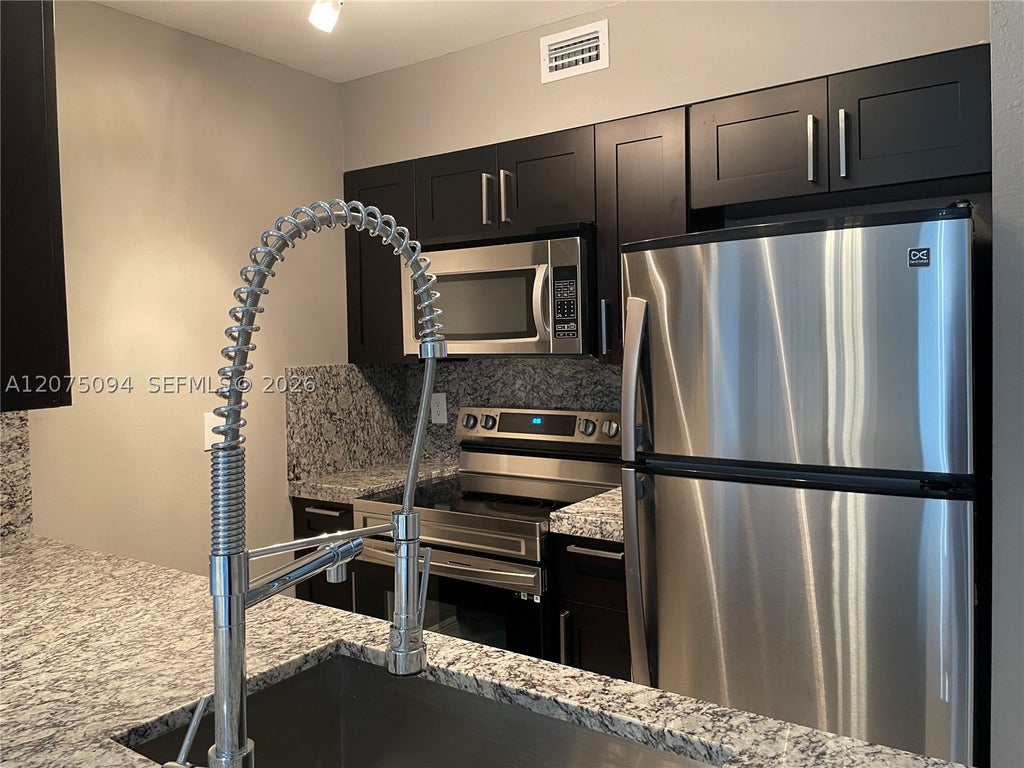 Photo of 4158 Inverrary Dr #503, Lauderhill, FL 33319 (MLS # A12075094)
