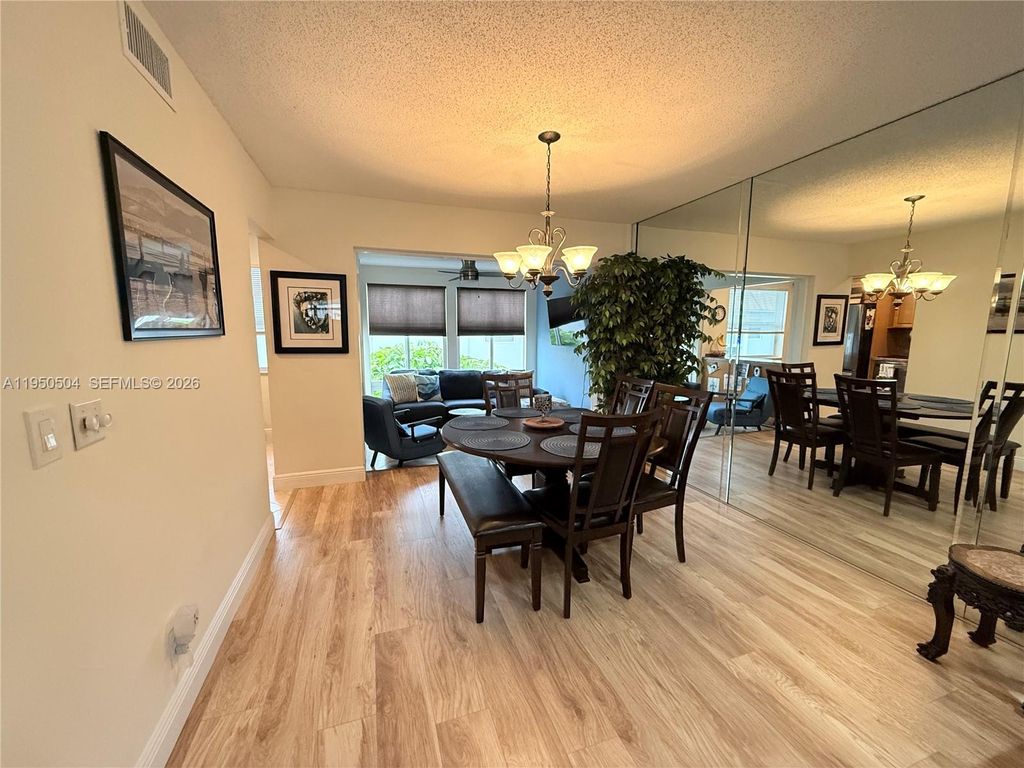 Photo of 18 Colonial Club Dr #202, Boynton Beach, FL 33435 (MLS # A11950504)