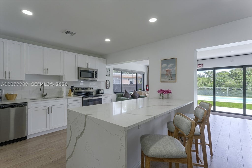 Photo of 317 N 31st Ave, Hollywood, FL 33021 (MLS # A12079909)