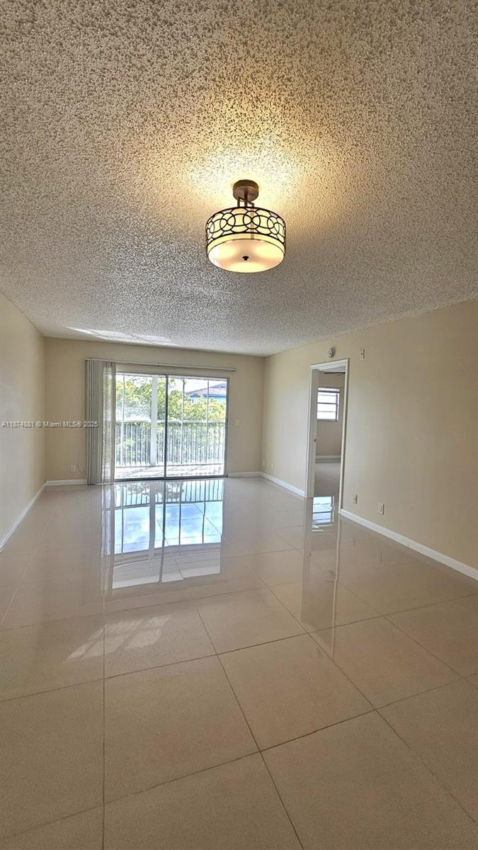 Beautiful 2 bed, 2 bath Apt in Century Village on the top floor. This unit has a washer/dryer in the unit. Tile floor, Remodeled Kitchen and Bath, There is a balcony with a screened in patio out back, Multi Million Dollar Clubhouse, pools, tennis, transportation, private security, guarded gates and more.