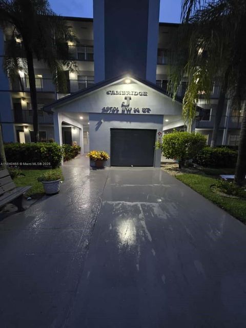 Photo of 12701 SW 14th St #312J, Pembroke Pines, FL 33027 (MLS # A11840465)