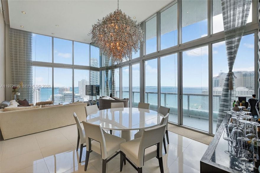 READY TO MOVE IN!! Live in luxury in this impressive Brickell condominium featuring double-height ceilings, panoramic ocean views, and professional décor. Located in a premier building with 5-star amenities in the heart of Brickell, this residence offers a resort-style lifestyle just steps from restaurants, shops, and the financial district