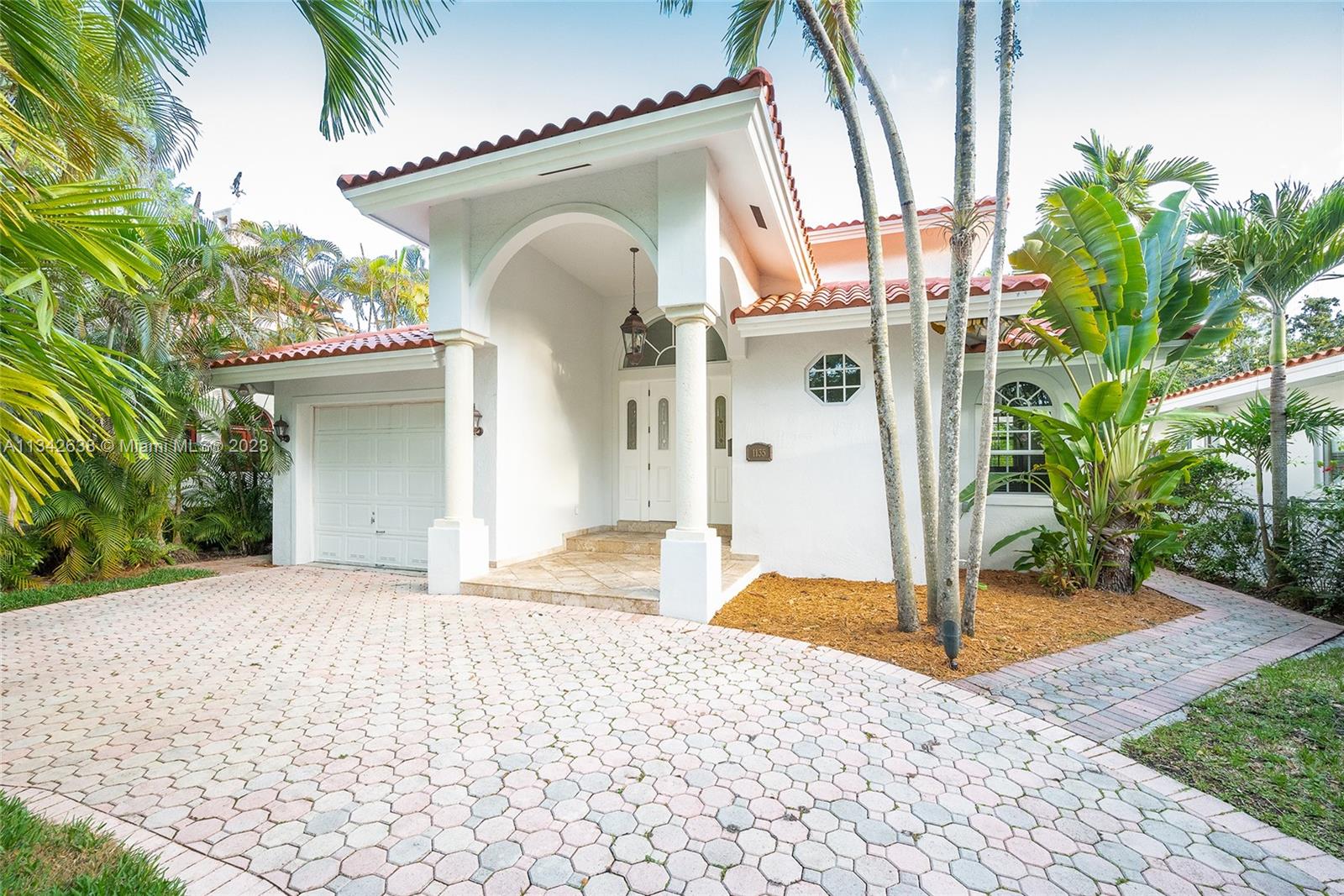 Enchanting 2-story 4 bdrm/4 bath home welcomes you. This home is located on the picturesque street of Asturia Ave. House features a grand living/dining rm & a family rm overlooking the pool area. Spectacular kitchen comes w/ stainless steel apps, custom-built wood cabinets w/ white quartz countertops, breakfast area, warming drawer, & oven is a microwave convection oven. Gorgeous master suite located upstairs w/ private balcony overlooking the pool. Enjoy the dual closets plus a hanging closet. Master bath has a jacuzzi tub & steamed shower. Find 2 add'l bdrms upstairs with Jack/Jill bath & lots of closet space. Also, features 1 nice sized bdrm downstairs. Add'l features: Heated Pool, 1 car gar, laundry rm, impact win/doors, full cabana bath. Within walking distance to Granada Golf Crs