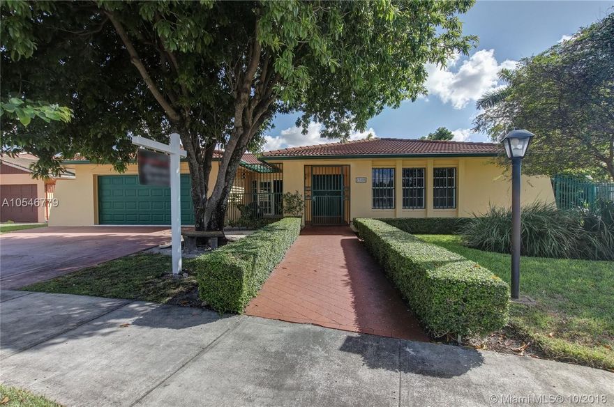 Amazing opportunity to own this 4-bedroom 2.5 bath home in sought after International Gardens. Home has been updated. Kitchen with granite counter-tops, solid wood cabinets, stainless steel appliances, gas stove top with electric oven, and Island with wine cooler.  Home features spacious open floor plan with lots of natural light. Walk-in closets, tile floors throughout, French doors leading to large covered patio, back yard shed, fruit trees and accordion shutters.  Located minutes to Florida's Turnpike, many restaurants, and shopping centers.