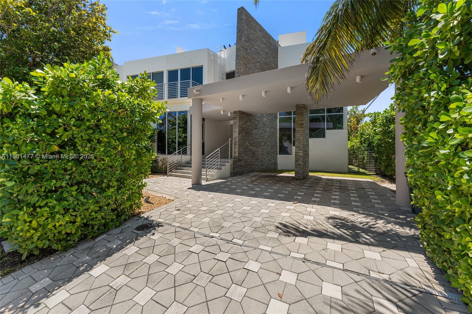 Welcome to The Village Green House, a modern 4-bedroom, 3-bath residence in one of the most coveted locations of Key Biscayne. Set just behind the Recreation Center—an epicenter of wellness, sports, and community—and across from Village Hall and Village Green Park, it offers the ultimate convenience. Expansive windows bathe the home in natural light, creating bright and welcoming spaces. Enjoy a private pool, a rooftop terrace for unforgettable sunsets, and the comfort of an elevator. With no association restrictions, you’ll have complete flexibility for your sport cars, golf cart, bikes, and surf equipment. Just steps to the beach, shops, dining, and parks, this is more than a home—it’s the perfect expression of island living in Key Biscayne.