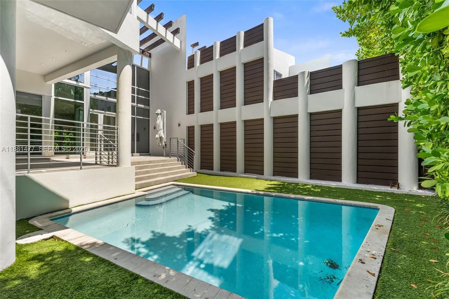 Welcome to The Village Green House, a modern 4-bedroom, 3-bath residence in one of the most coveted locations of Key Biscayne. Set just behind the Recreation Center—an epicenter of wellness, sports, and community—and across from Village Hall and Village Green Park, it offers the ultimate convenience. Expansive windows bathe the home in natural light, creating bright and welcoming spaces. Enjoy a private pool, a rooftop terrace for unforgettable sunsets, and the comfort of an elevator. With no association restrictions, you’ll have complete flexibility for your sport cars, golf cart, bikes, and surf equipment. Just steps to the beach, shops, dining, and parks, this is more than a home—it’s the perfect expression of island living in Key Biscayne.