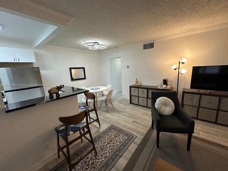 This turnkey 1-bedroom, 1-bathroom condo in Hollywood is an absolute gem. Totally remodeled, the unit has new and modern tile floors, an open kitchen with new appliances and countertops, and beautiful solar shades and blackout curtains. The updates continue with new furniture and new lighting, ensuring you can move right in. Its central location is unbeatable: you're just two blocks from Hollywood Boulevard’s vibrant  restaurants and cafes, about 10 minutes from the beach, and enjoy easy access to I-95 and US-1. The condo is in a small building and includes one assigned parking space and an on-site laundry room.