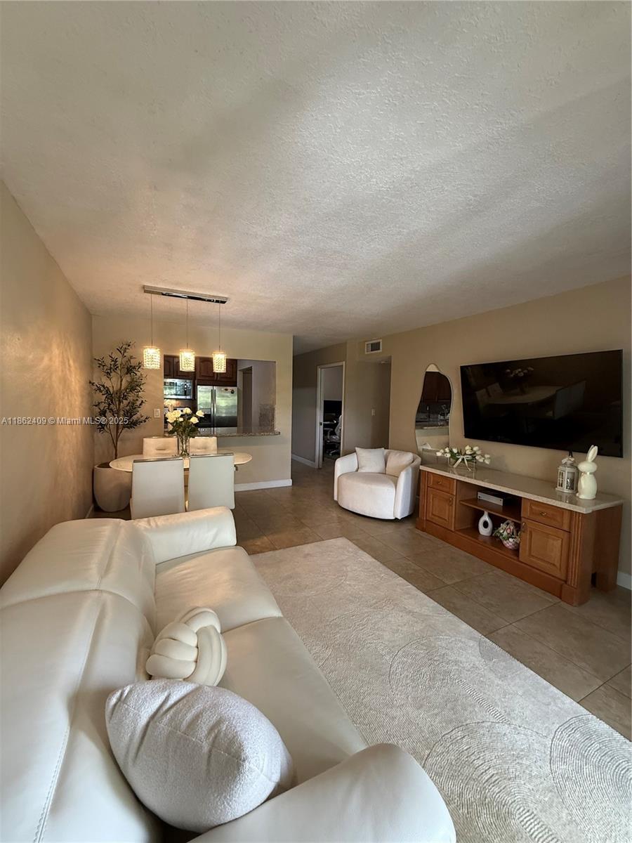 Prime location in the heart of Hialeah! This spacious apartment offers 2 bedrooms, 2 bathrooms +1 Den that can be used as an office, playroom, or guest space. Featuring new impact windows and located in a building that has been completely renovated, including balconies, this unit is in excellent condition, filled with natural light, and very well maintained. Conveniently close to shopping, dining, and major highways, an ideal place to call home or rent if you are an investor.