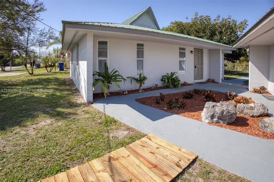 Remodeled Waterfront Duplex with Income Potential in the Sun and Lakes Community! Live on the lake and earn income! This updated duplex features 2 separate houses—each with new shaker kitchens, quartz counters, stainless steel appliances, new A/Cs, brand-new water filtration system, and metal roofs. Unit 1: 2BR/1BA + sun room, Unit 2: 1BR/1BA + sun room—perfect for guests or extra income. Huge ¼-acre corner lot with canal access to Lake Grassy—bring your boat or jet skis! Enjoy community amenities: boat ramp, tennis, pickleball, clubhouse, included with your property taxes $35/year. Great for investors, Airbnb, or house-hackers. Live the lakefront lifestyle and let it pay for itself!