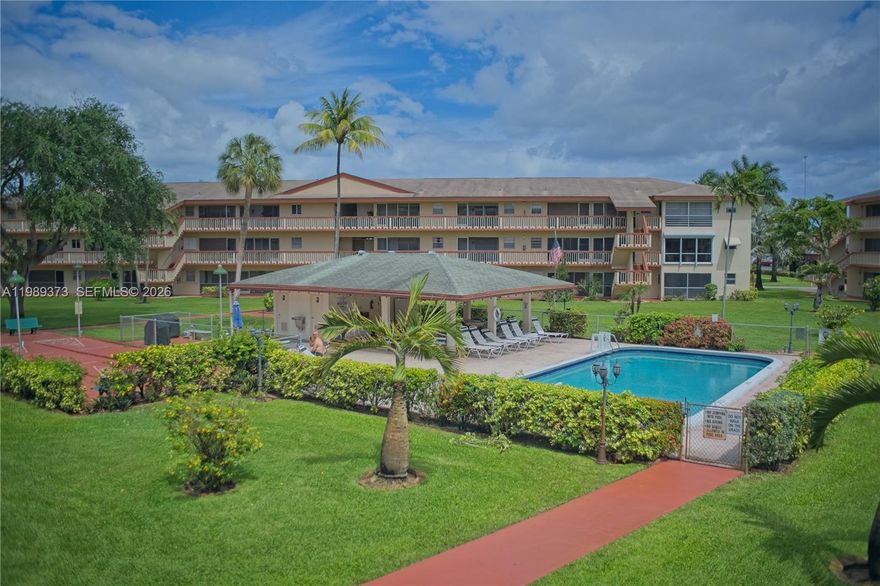 Beautiful 1 bed / 1 bath condo in the desirable Beverly Hills 55+ gated community, offering a perfect blend of comfort and convenience. This freshly painted, light-filled unit features neutral tile flooring throughout, an updated bathroom, ceiling fans, custom blinds, and a brand-new A/C for peace of mind. Unwind on your spacious screened-in porch with tranquil views of the pool and lush palm trees. Residents enjoy resort-style amenities including a clubhouse with library, fitness center, billiards room, full kitchen, and social/dining areas, plus a pool, BBQ area, petanque, bocce, shuffleboard, and courtesy bus service. Monthly HOA covers landscaping, water/sewer, trash, building insurance, and exterior maintenance—making for truly low-maintenance living. Ideally located just minutes from major highways, top dining and shopping, airports, casinos, and South Florida’s beautiful beaches, this is an exceptional opportunity you don’t want to miss.