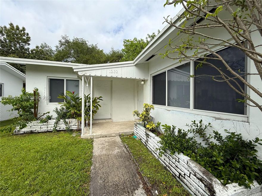 Gorgeous and spacious three bedroom/two bathroom duplex with oversized backyard by Jackson Health Systems. Fenced entry to the duplex features a charming front porch with two entrances. The first entrance leads to the large living room and connecting dining area. The kitchen has granite countertops and is complete with stainless steel appliances including dishwasher, electric stove/range, microwave, and refrigerator. The master bedroom has a walk-in closet and an en-suite bathroom with shower along with a private entrance on the front porch. The second and third bedrooms have closets and large windows. The second bathroom has white subway tile and a white vanity. Linen closet in hallway. Central A/C. Oversized backyard with fruit trees. Onsite parking.