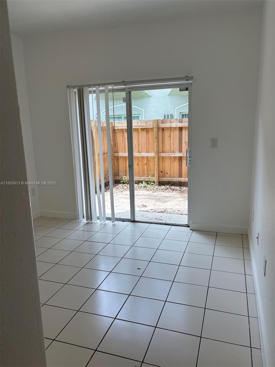 Bright first floor unit with fenced patio. Freshly painted, tile and laminated wood floors, full equipped kitchen , washer/dryer included. Community amenities include security 24 hours, two swimming pools, basic cable tv. Unit has two assigned parking spots. The community is located within 10 minutes drive of the Baptist Health Homestead hospital, the Homestead Speedway, schools, and shopping centers.