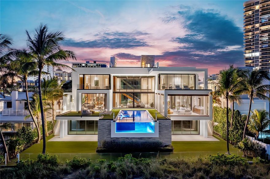 Fort Lauderdale Beach’s premier modern oceanfront estate commands 100 ft of pristine shoreline, defining contemporary coastal luxury. Built by Bomar Builders & spanning 10,000+ SF, every finish was meticulously curated—from globally sourced stone & bespoke millwork to Poliform closets & sculptural lighting. Soaring glass walls frame the Atlantic, opening to a floating infinity-edge pool overlooking the horizon. Designed for effortless entertaining, the main level flows through open living, dining & lounge areas to a gourmet chef’s kitchen that opens to the terrace & summer kitchen overlooking endless ocean views. Blending seamlessly into the home’s open design, the primary suite evokes serenity, w/ an oceanfront terrace, spa-inspired bath & resort-level tranquility.