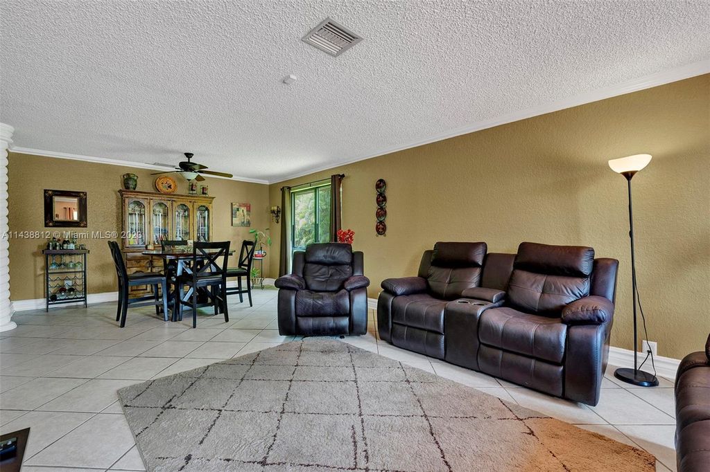 Photo of 2068 NW 100th Way, Coral Springs, FL 33071 (MLS # A11438812)